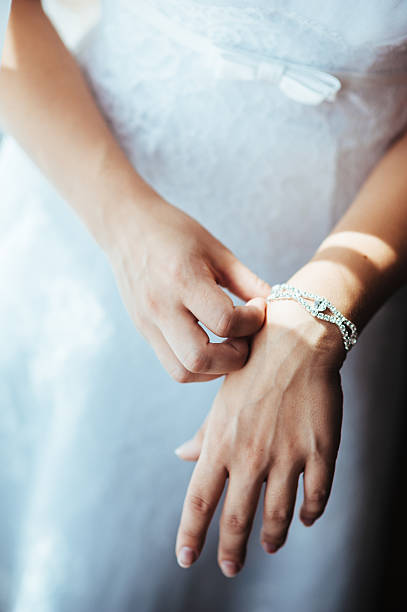 istock beautiful bride getting ready in white wedding dress with hairstyle 475225402