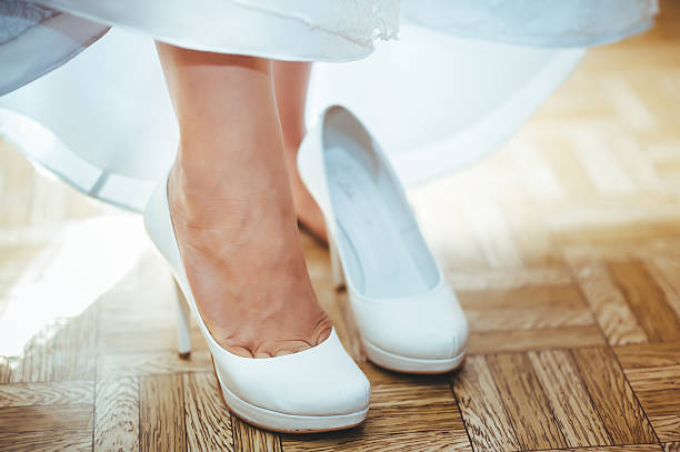 istock beautiful bride getting ready in white wedding dress with hairstyle 475225452