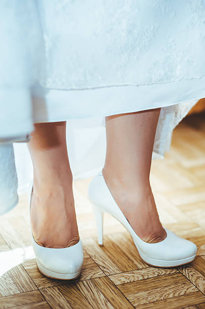 istock beautiful bride getting ready in white wedding dress with hairstyle 475225456