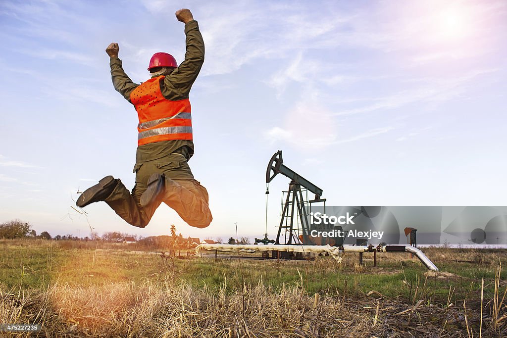Oil worker Oil Industry pump. worker jumps Adult Stock Photo