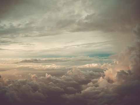 Cluster of clouds with gloomy colors and sunshine