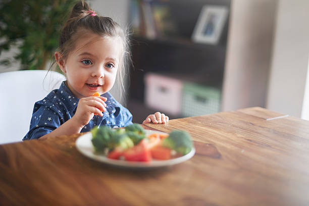 istock Lunch time! She's eating a healthy vegetables 475229162
