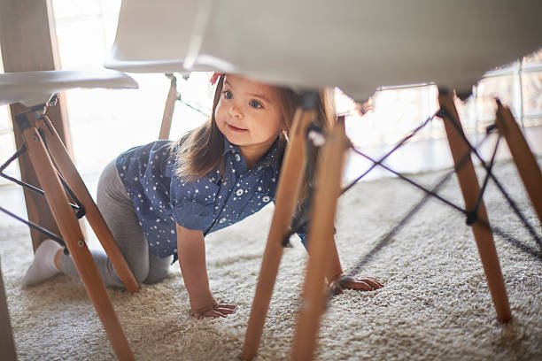istock Hidden little girl under the table 475229788