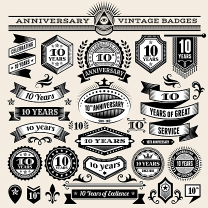 ten year anniversary hand-drawn royalty free vector background on paper. This image depicts a paper background with multiple anniversary announcement designs. The beige paper background serves a perfect backdrop for making the anniversary announcements look authentic and elegant. The hand-drawn design are unique and intricate in design and are ideal for your anniversary design announcements.
