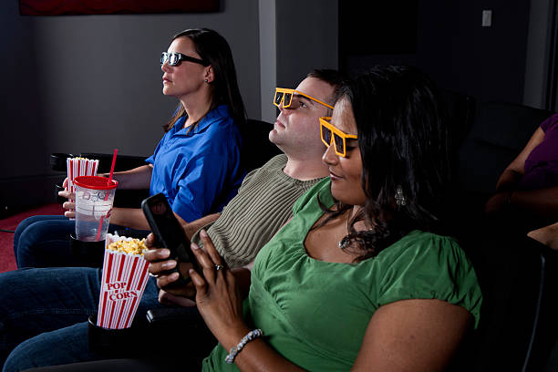 istock 3D Movies and using a cellphone in theater 475231393