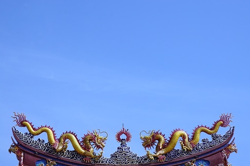 two dragons of Chinese fables on rooftop of the door gate