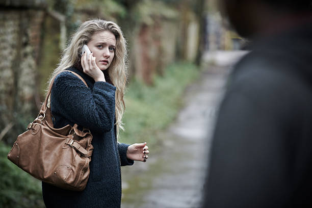 istock Teenage Girl Feeling Threatened As She Walks Along Path 475236199
