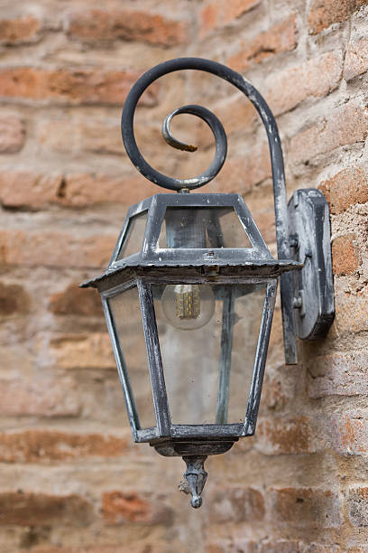 istock Old electric lamp on brick wall 475237298