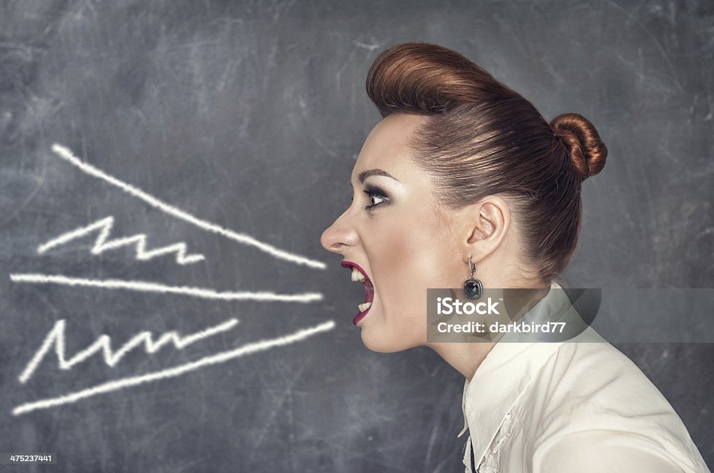 Screaming woman Screaming fashion woman on the blackboard background Adult Stock Photo