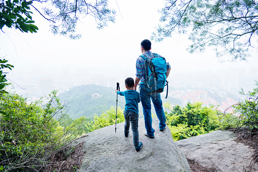 Father and son on the top of the hill