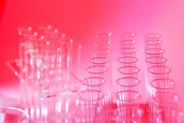 istock Science research laboratory, red pink background with test tubes 475244017