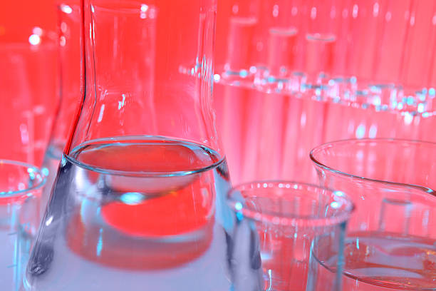 istock Science research laboratory, red background, glass flask, beakers, test tubes 475244053