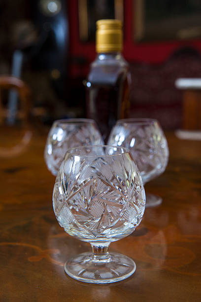 istock Crystal wine glasses and a bottle of brandy 475247549