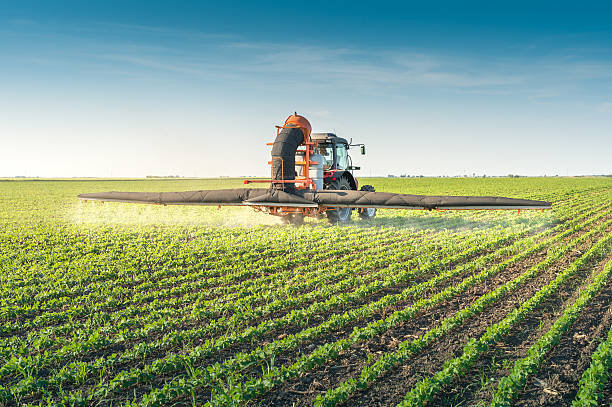 istock tractor spraying pesticides 475248346