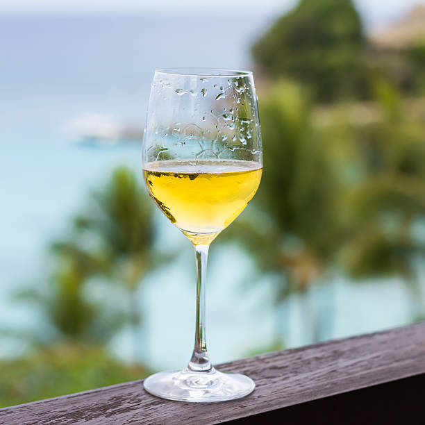 istock Glass of wine on balcony rail 475248365
