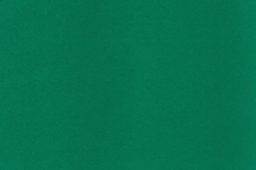 fragment of green velvet background on horizontal surface
