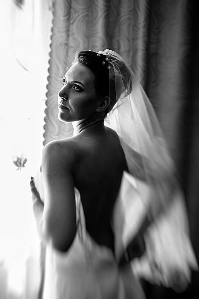 istock beautiful bride getting ready in white wedding dress with hairstyle 475248948