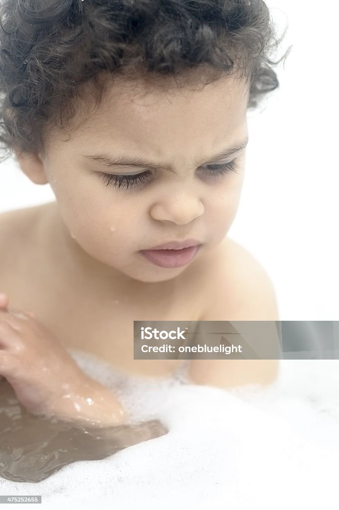 PEOPLE: Portrait of Child Having Fun In Bathroom. Royalty free stock photo of toddler having fun in bubble bath.  Shot in RAW, post processed in Prophoto RGB, no sharpening applied. This file has a  18-23 Months Stock Photo