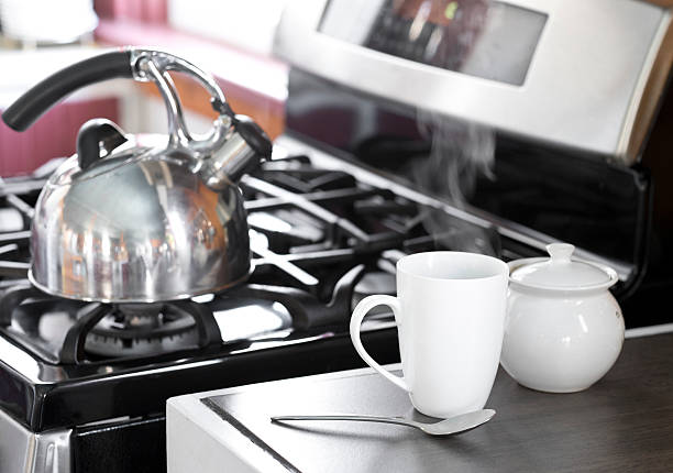 istock Steam Rises from a Tea or Coffee Cup, Home Kitchen. 475254028