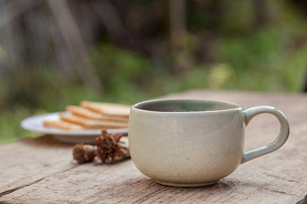 istock Cup of tea on wooden table 475258241