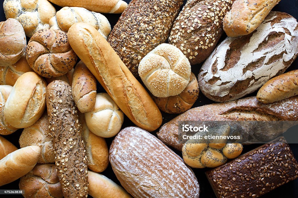 Many mixed breads and rolls shot from above. Bread Stock Photo