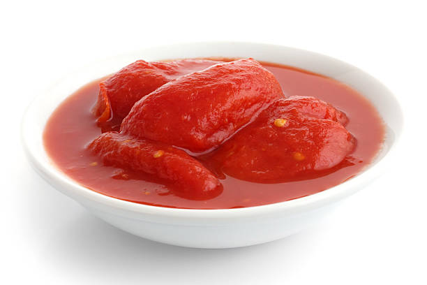 istock Whole canned tomatoes in white dish. Isolated. 475264784