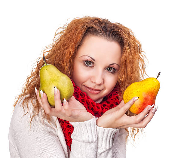 Red-haired girl with a pears