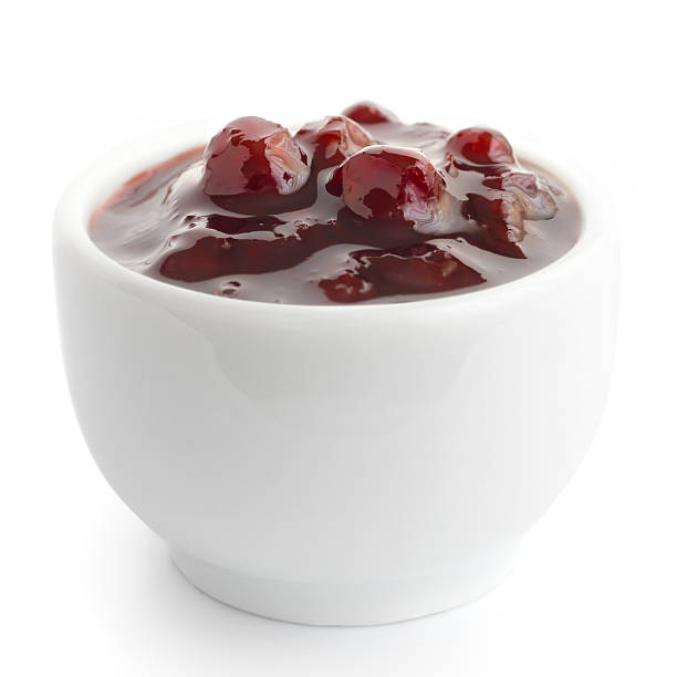 istock Small dish of cranberry sauce on white surface. 475273612
