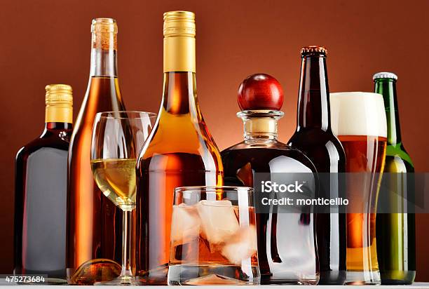 Bottles And Glasses Of Assorted Alcoholic Beverages Stock Photo - Download Image Now