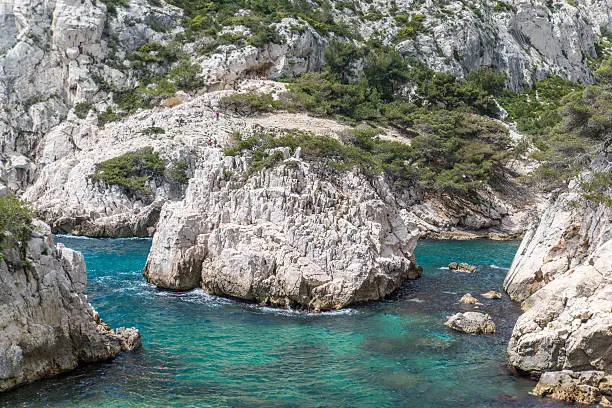 boulder in the middle of clear water. Calanque de Sugiton, Marseille, French riviera.