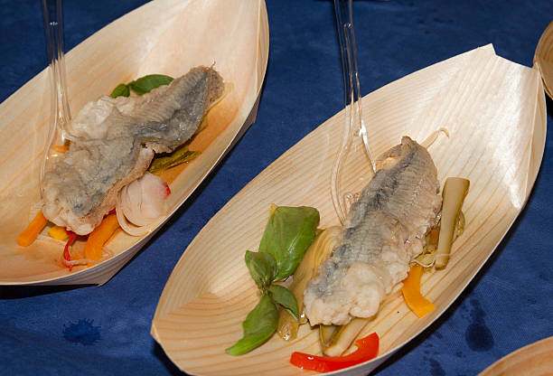 istock fish fillet on a bed of vegetables 475276202