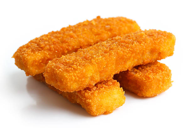 istock Four golden fried fish fingers stacked on white. 475276816