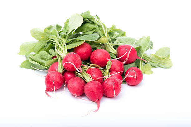 istock bunch of radishes isolated on white 475277586