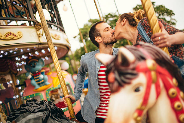 istock Kissing on the carousel ride 475280722
