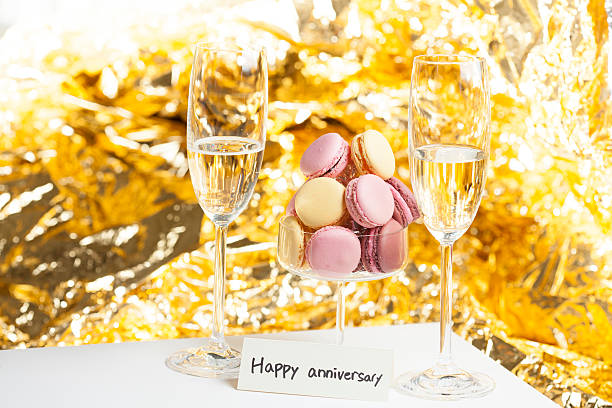 istock Macarons in glass with champain glasses, Happy anniversary 475280950