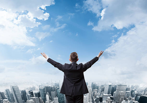 istock businessman looking at the city 475281122