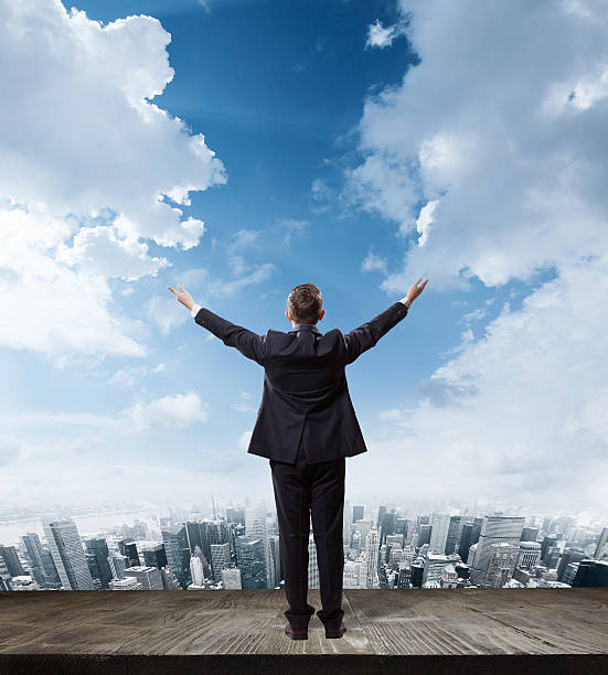istock businessman looking at the city 475281132