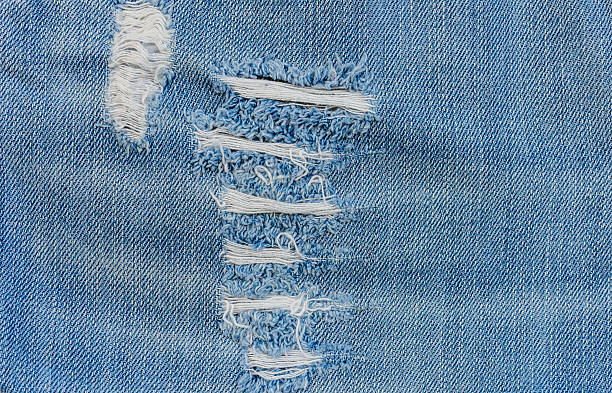 istock texture of old blue jeans at torn 475282442