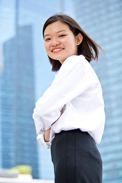 istock Young Asian female executive portrait at business district 475286076