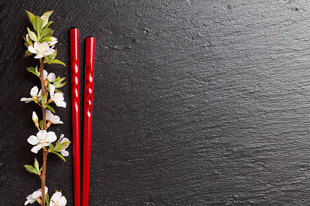 istock Japanese sushi chopsticks and sakura blossom 475291162