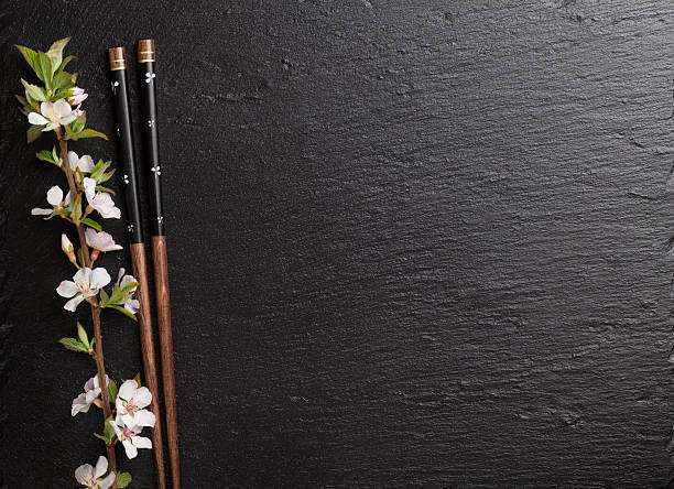 istock Japanese sushi chopsticks and sakura blossom 475291250
