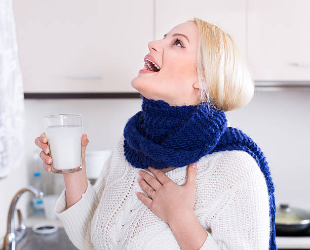 istock Young woman doing oral rinsing 475291576