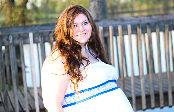 istock Pregnant Woman Smiles For Camera 475292294