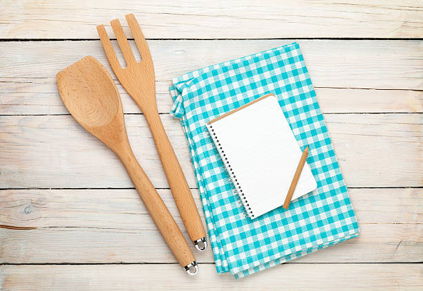 istock Kitchen utensil and notepad over wooden table 475292318