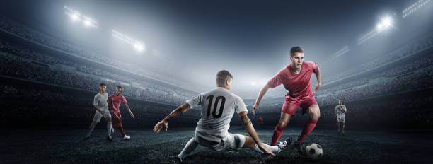 istock Soccer player kicking ball in stadium 475292660