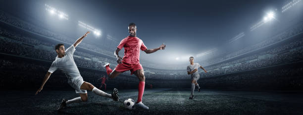 istock Soccer player kicking ball in stadium 475292662