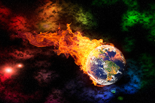 burning earth is flying through the outer space.