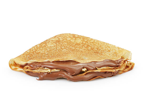 fresh hot blinis or crepes  with chocolate spread isolated