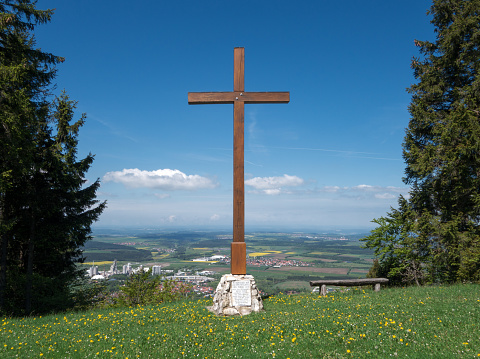 Cross on the Plettenberg, Swabian Alps, Germany: big mountain cross made of oak wood between two spruces overlooking Dotternhausen and Dormettingen. 