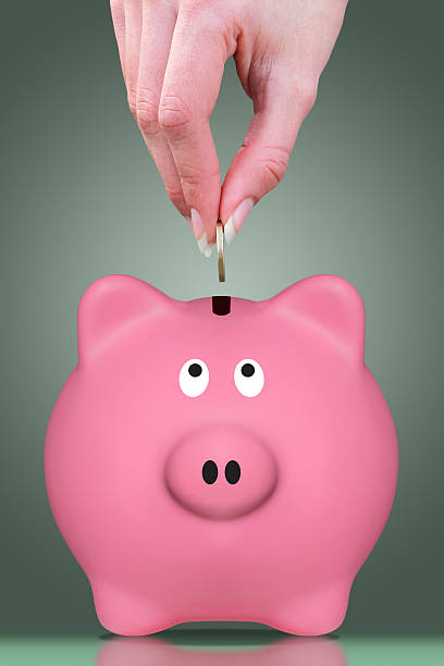 istock Fingers and piggy bank 475295781
